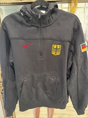 Nike Black Men's Germany Crest Half-Zip Puffer Hoodie with Red Swoosh